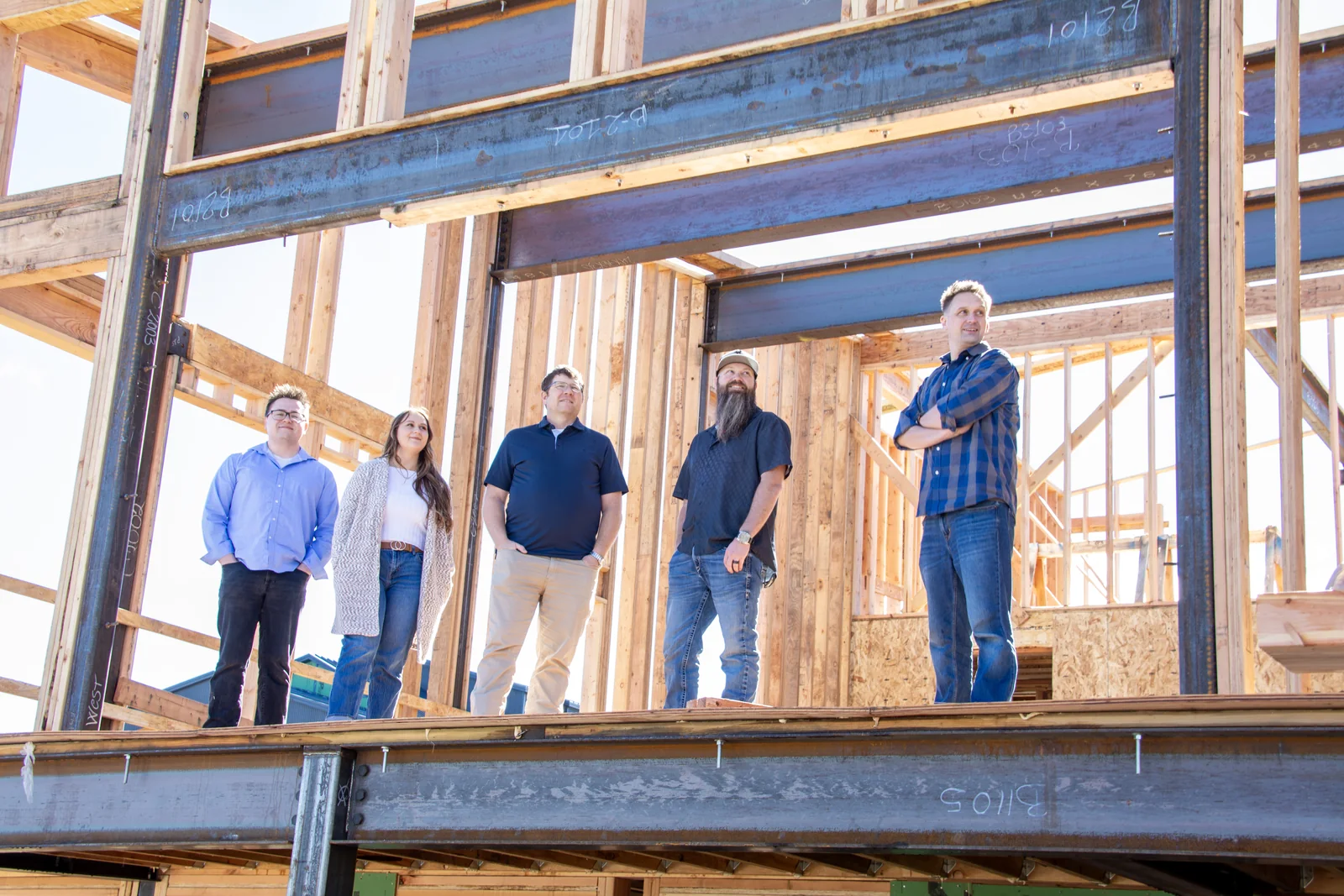 The RAD Architectural Design team on the steel deck of a building under construction