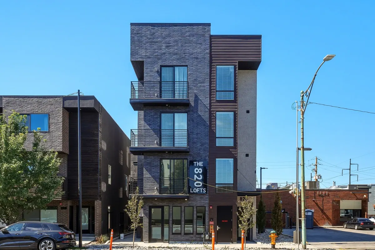 820 Lofts street-level view of brick facade and upper balconies
